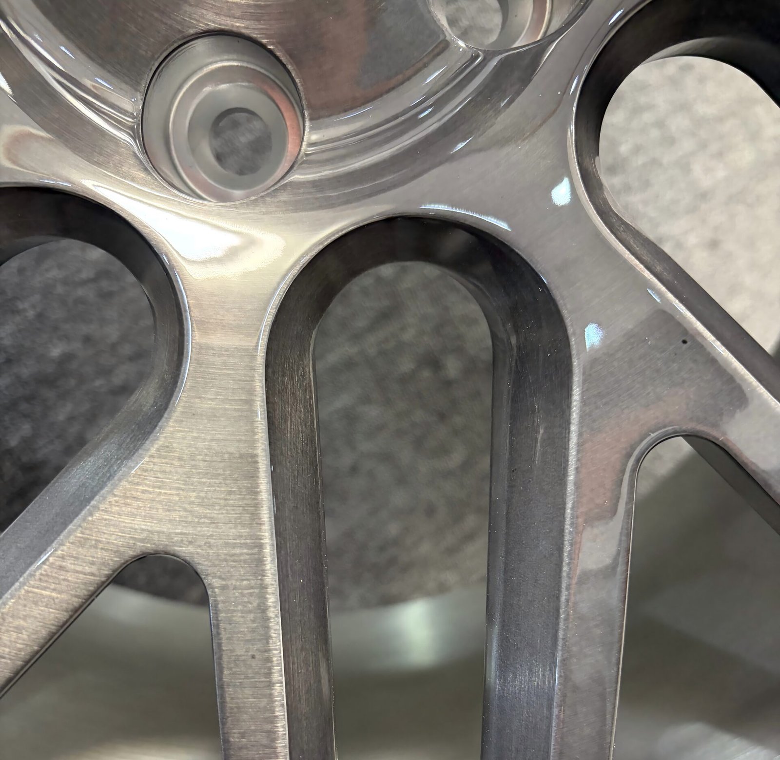 Macro close-up of brushed aluminum wheel finish texture