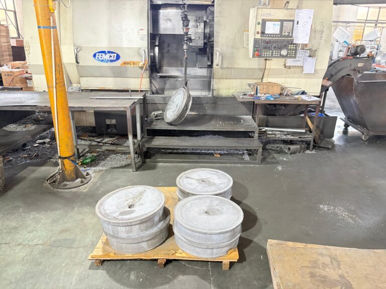 CNC lathe turning a forged wheel blank to its final barrel diameter at the ANKUSI factory