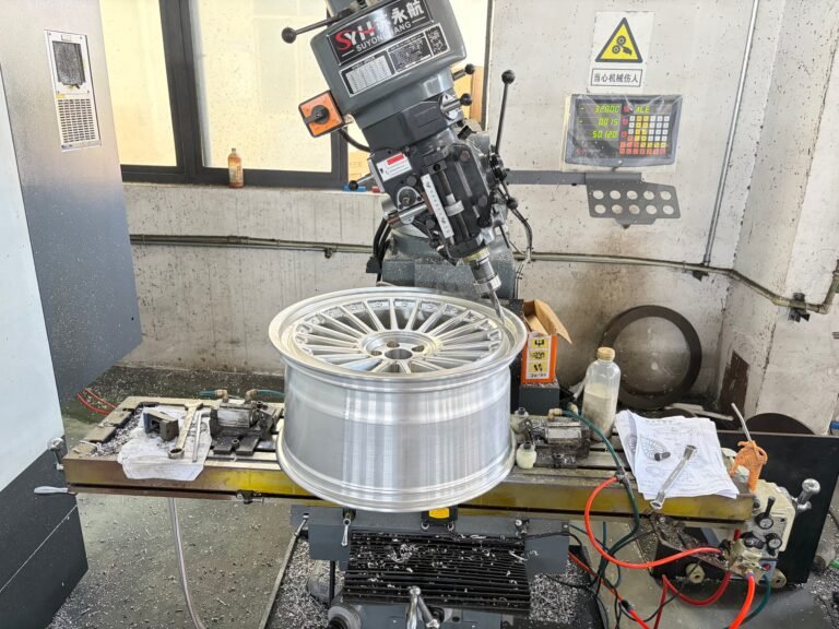 Drilling the valve stem hole into a finished forged wheel barrel
