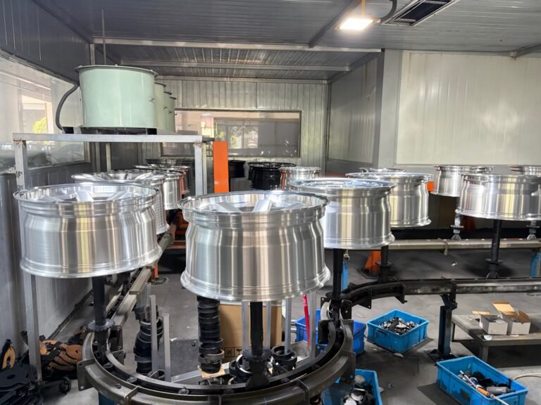 Spray painting a forged wheel on ANKUSI's coating line