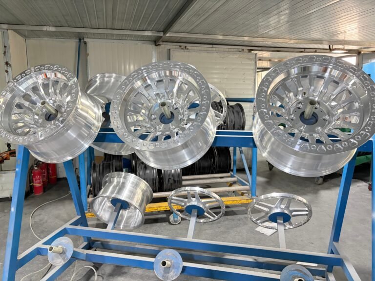 Forged wheels racked and awaiting paint coating