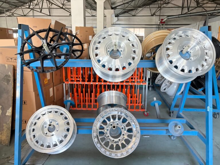 Additional forged wheels staged in the paint preparation area
