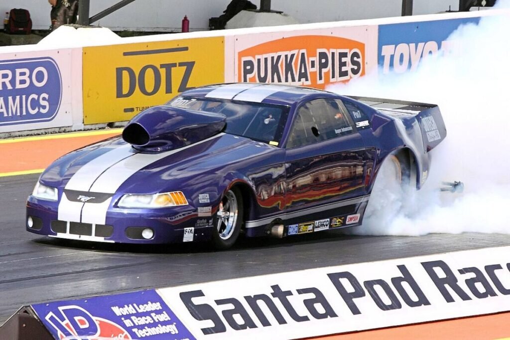 Pro Mod Ford Mustang drag car burnout at Santa Pod, the kind of high-power launch where beadlock drag wheels come into play