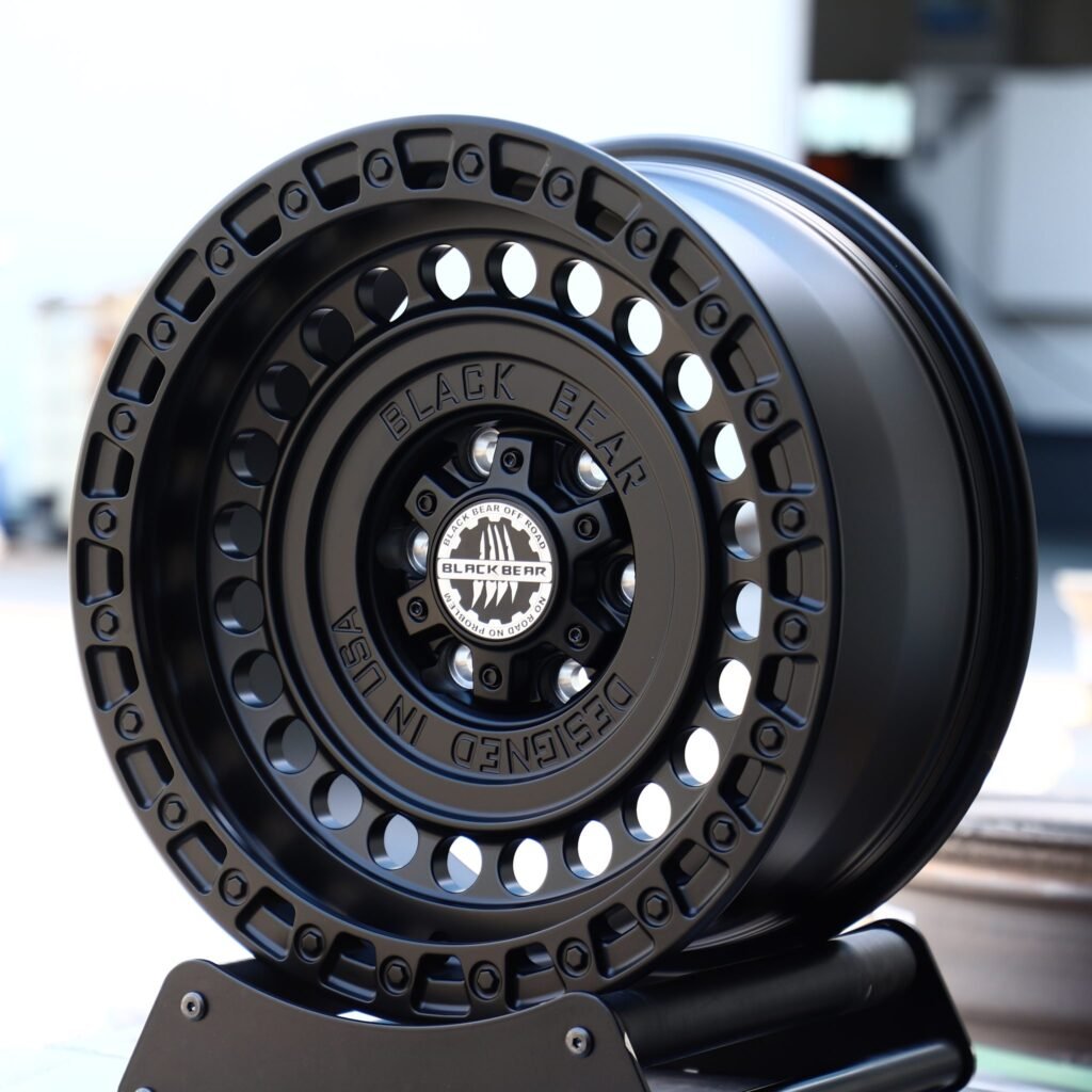 Toyota Tacoma wheels – Black Bear Gloss Black Full-Face Exposed Bolt Detail, angled view