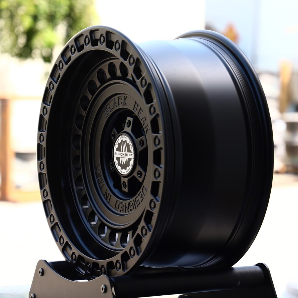 6x139.7 wheels – Black Bear Gloss Black Full-Face Exposed Bolt Detail, side view