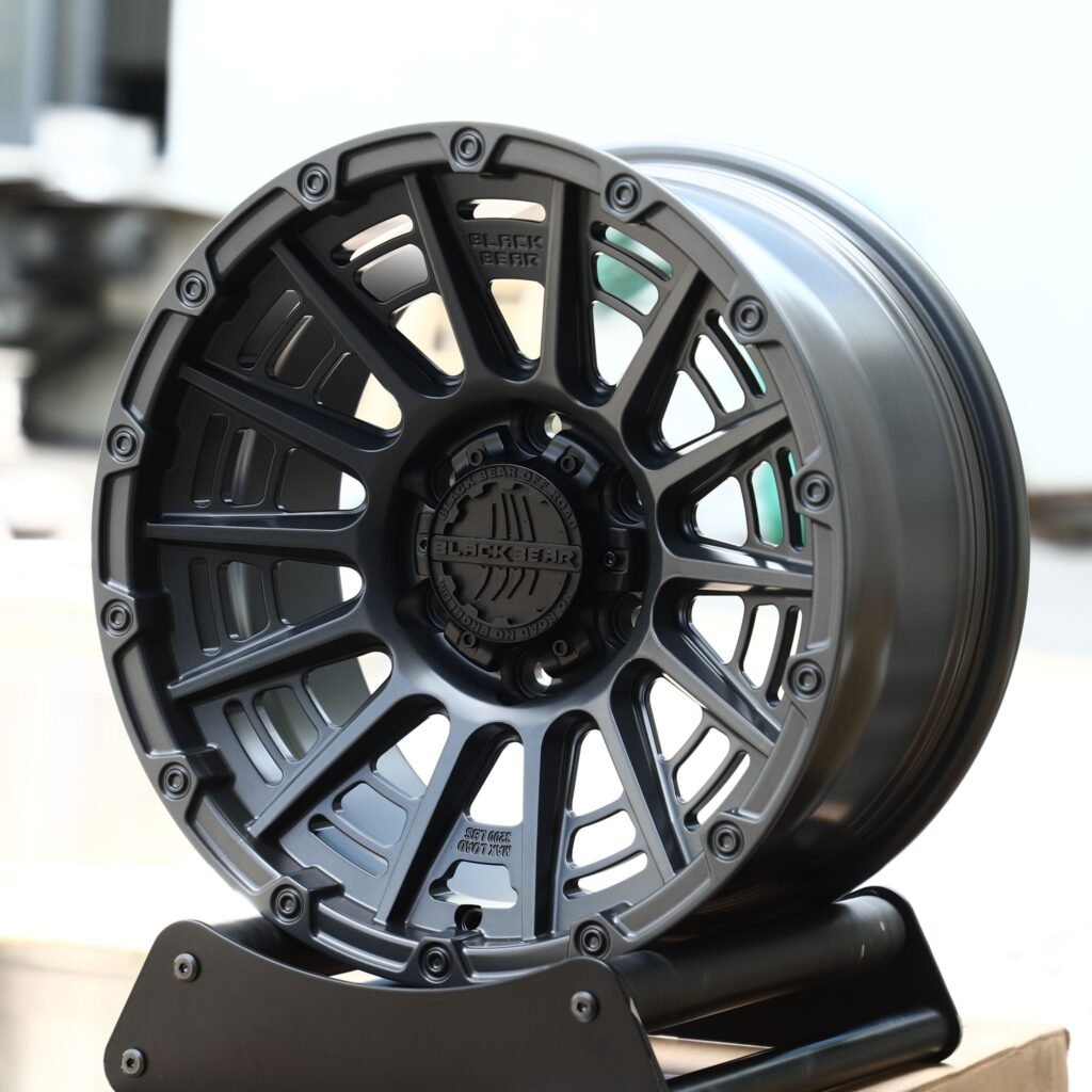 Toyota Tacoma wheels – Black Bear Gray Exposed Bolt Detail Double Ring Lip, angled view