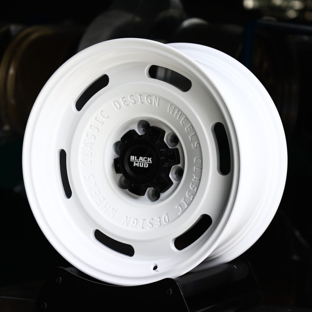 Toyota Tacoma wheels – Black Mud Gloss White Full-Face, angled view