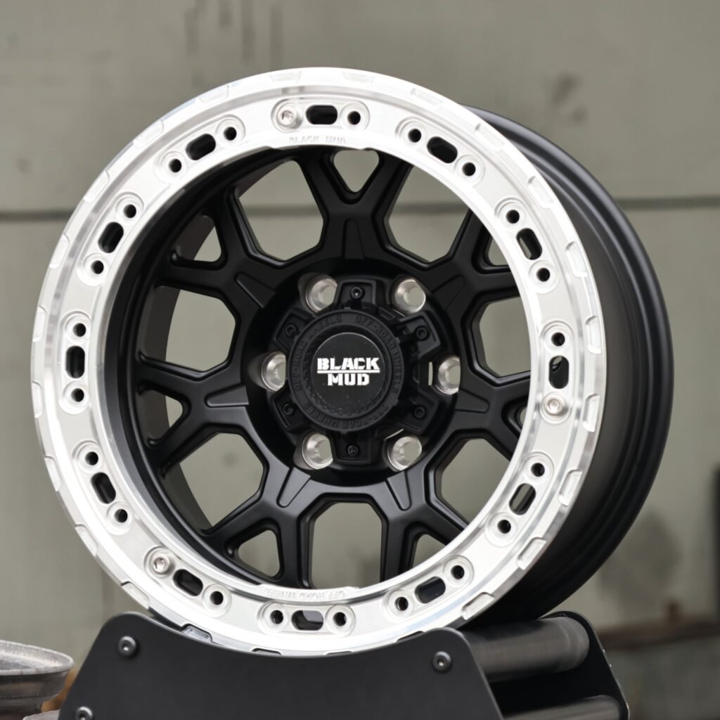 Toyota Tacoma wheels – Black Mud KMC Gloss Black Custom Beadlock, angled view