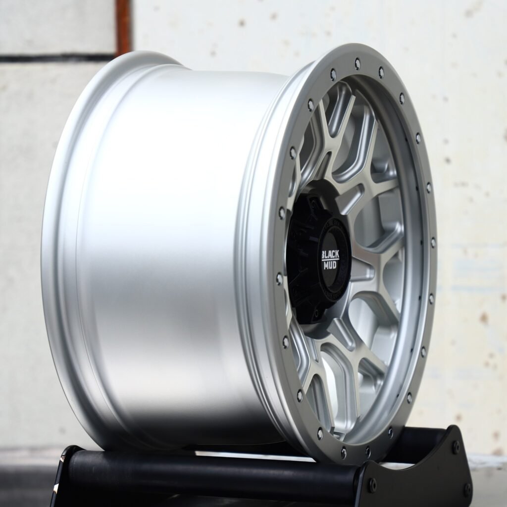 Toyota Tacoma wheels – Black Mud Silver Exposed Bolt Detail, angled view