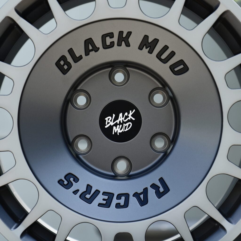 Chevrolet Silverado 1500 wheels – Silver / Gunmetal Slotted Rally Dish (Black Mud-Style), lip and barrel detail