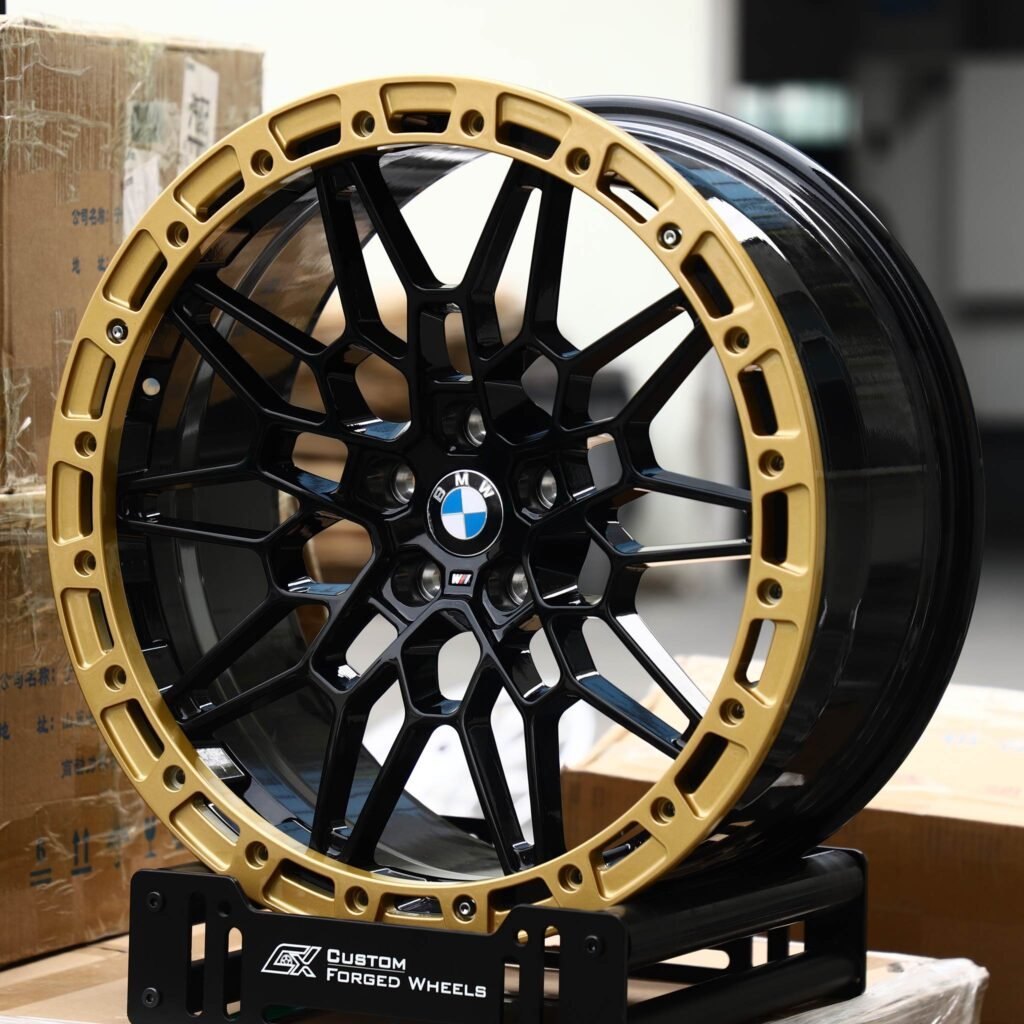 BMW M5 wheels – Gloss Black Mesh Gold-Ring Beadlock (BMW OEM-Style), angled view