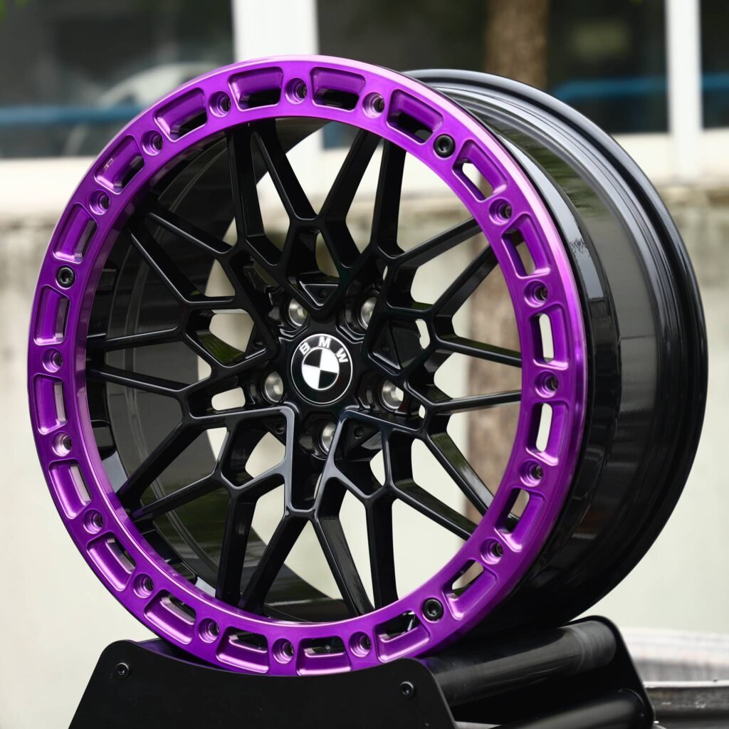 BMW M5 wheels – Gloss Black / Purple Mesh Beadlock (BMW OEM-Style), angled view