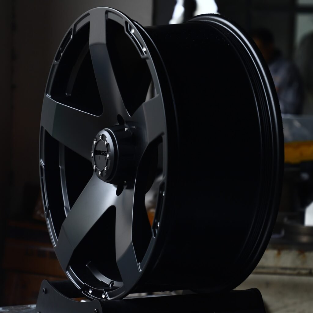 6x139.7 wheels – Matte Black 5-Spoke Riveted Lip (Boss-Style), side view