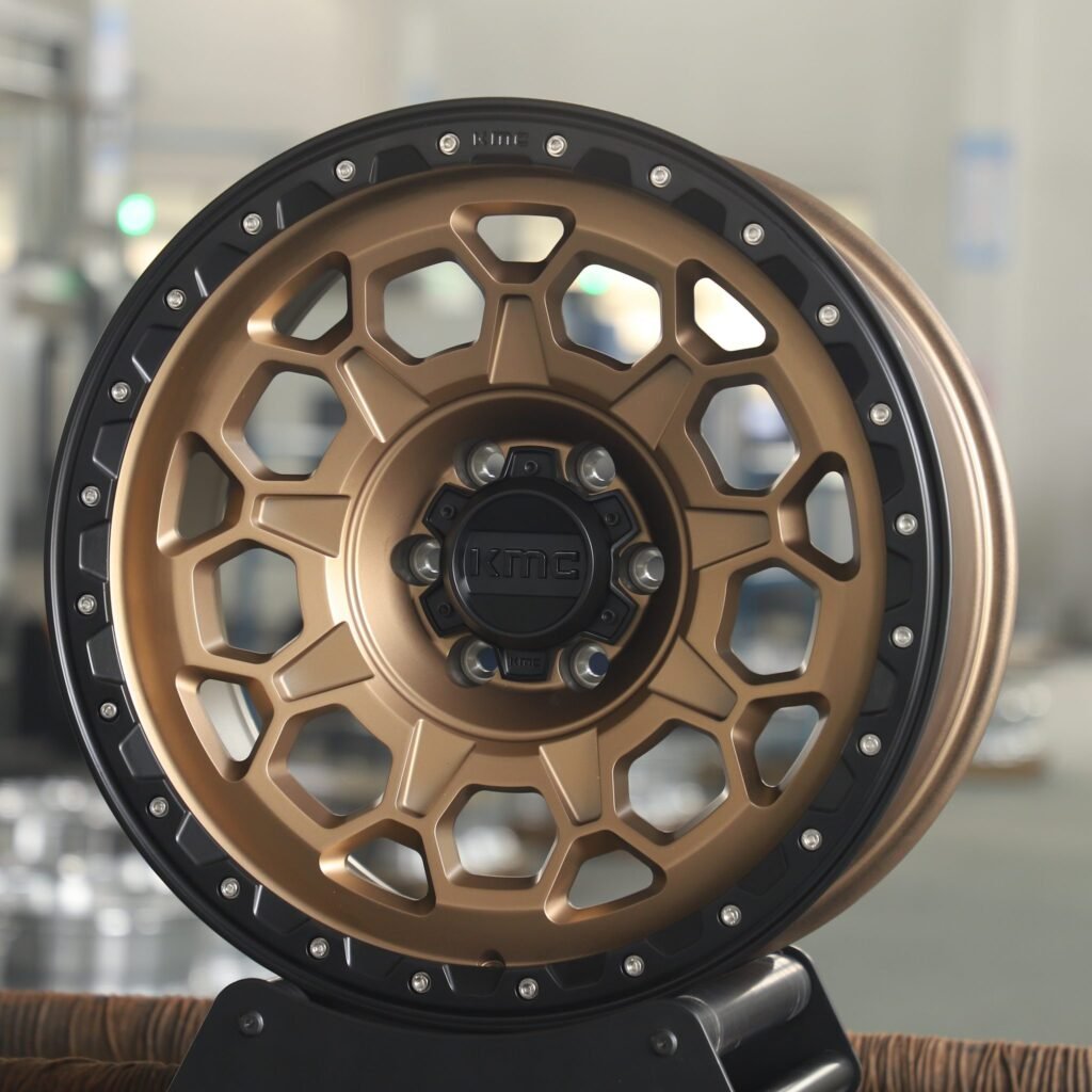 Toyota Tacoma wheels – Bronze / Gloss Black Exposed Bolt Detail (KMC-Style), angled view