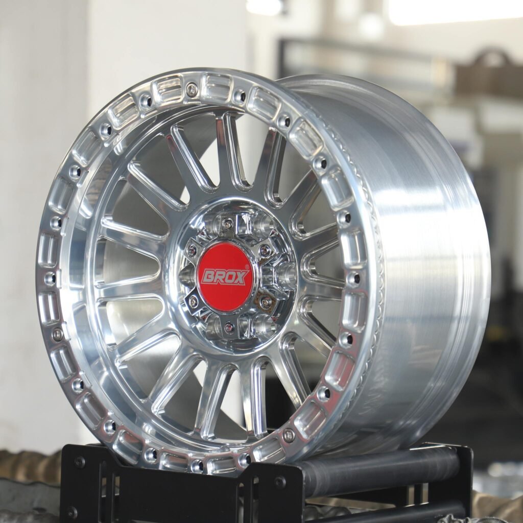 Toyota Tacoma wheels – BROX Silver 15-Spoke Beadlock, angled view