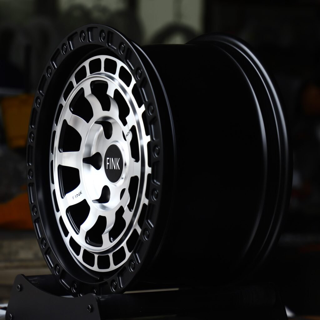 6x139.7 wheels – Gloss Black / Machined Slotted, side view