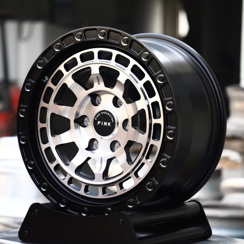 Toyota Tacoma wheels – Machined Silver / Black Beadlock (Fink Industries-Style), angled view