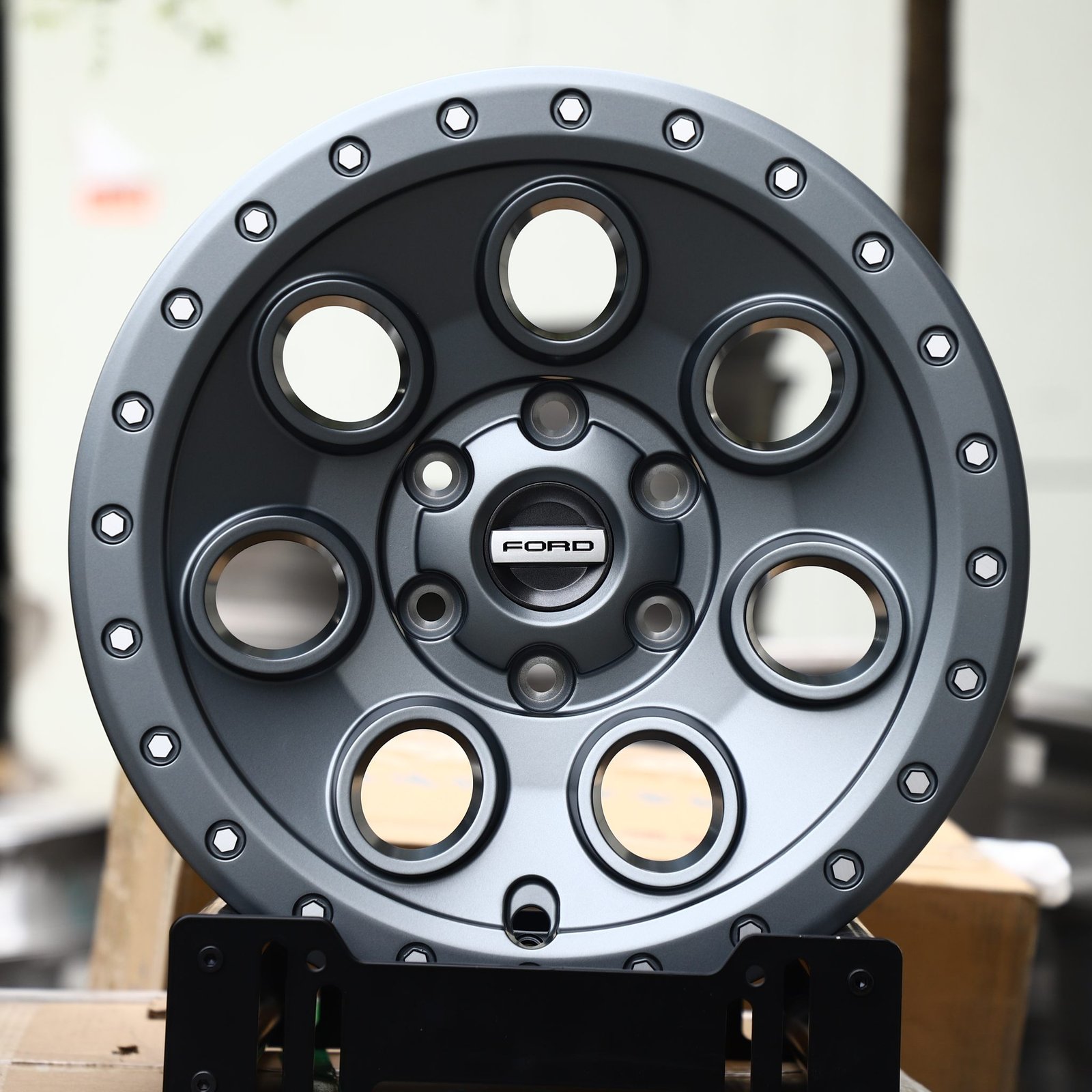Ford F-150 wheels – Matte Gunmetal Round-Hole Beadlock (Ford OEM-Style), front view