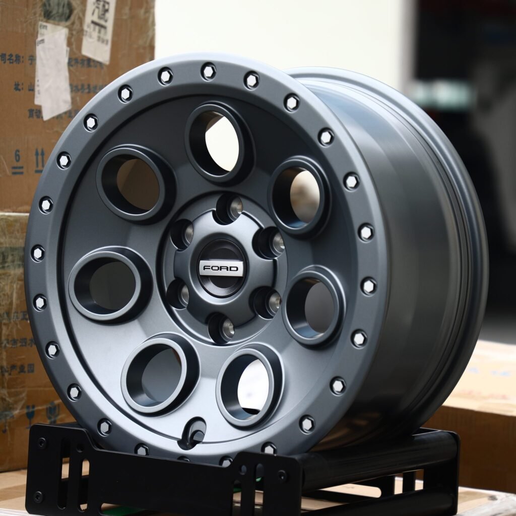 Ford Bronco wheels – Matte Gunmetal Round-Hole Beadlock (Ford OEM-Style), angled view
