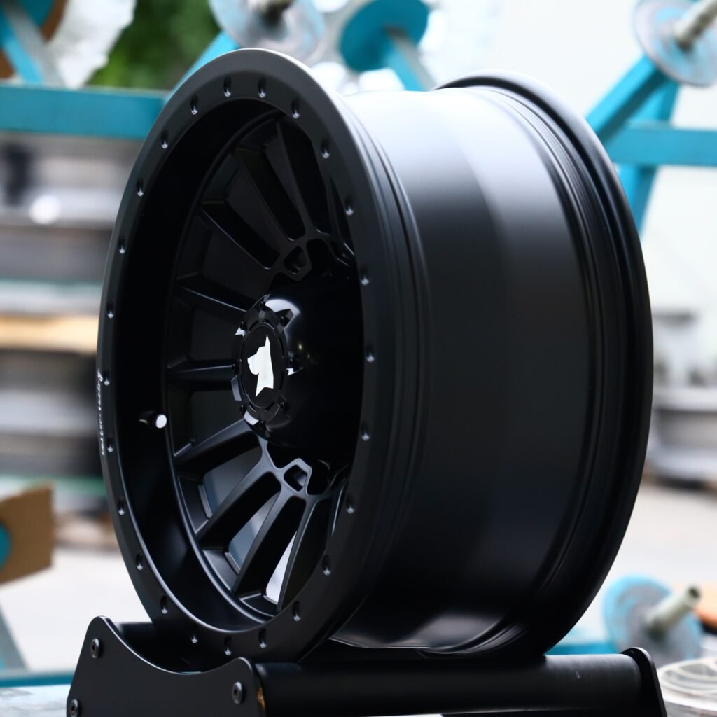 Chevrolet Silverado 2500HD wheels – Gloss Black 16-Spoke Exposed Bolt Detail, angled view