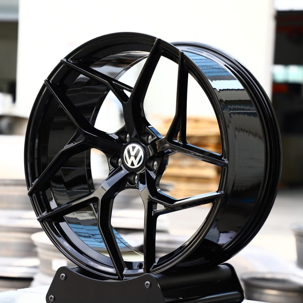 Volkswagen Golf R wheels – Gloss Black Concave Directional Milled (Volkswagen OEM-Style), angled view