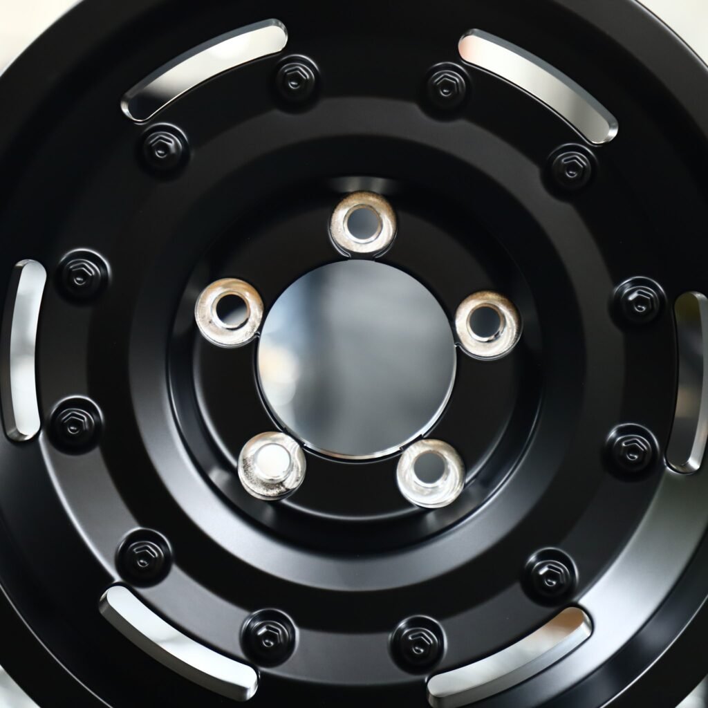 5x127 wheels – Gloss Black Exposed Bolt Detail, side view
