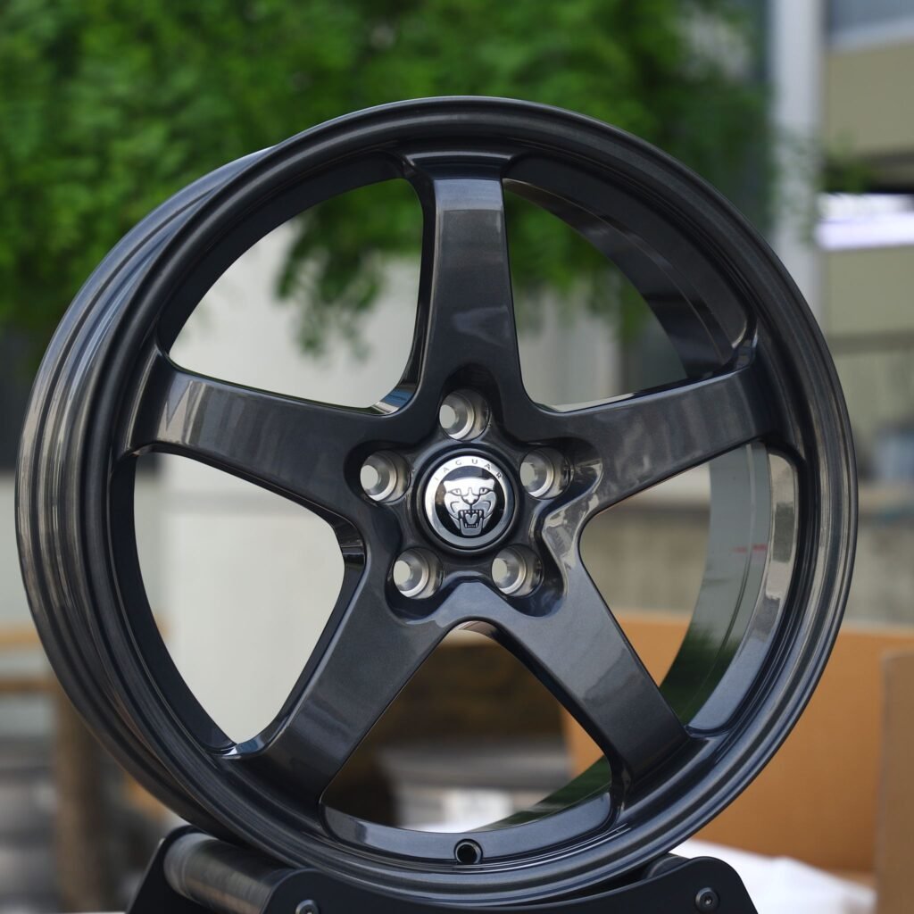 Jaguar XE wheels – Gloss Black / Gunmetal 5-Spoke (Jaguar OEM-Style), angled view