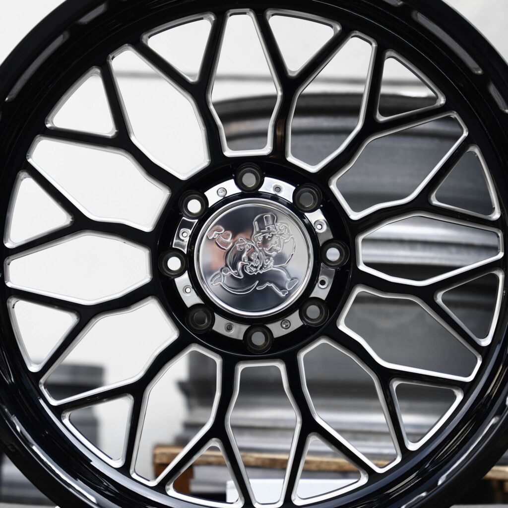 Chevrolet Silverado 2500HD wheels – Gloss Black / Machined H-Type 12-Spoke, angled view