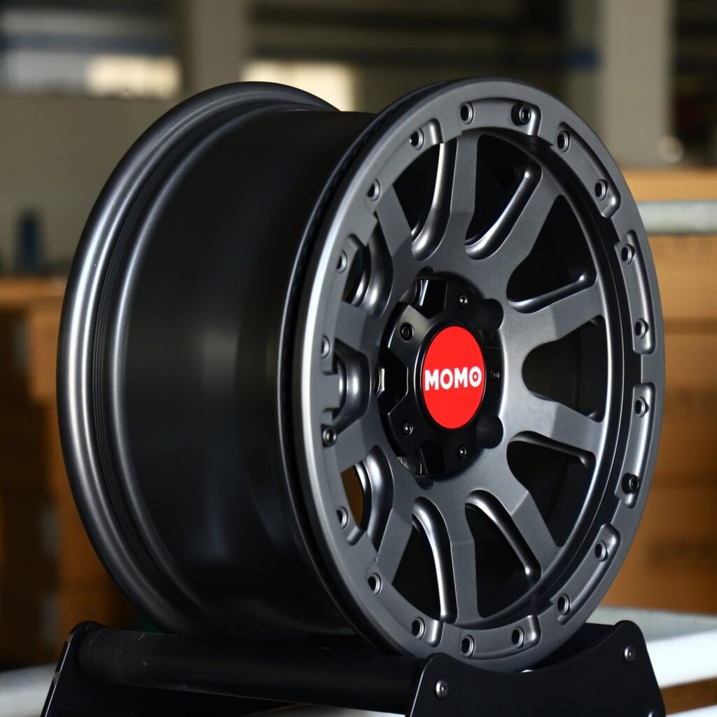 6x139.7 wheels – Gray / Gloss Black / Gunmetal Custom Beadlock (Momo-Style), side view
