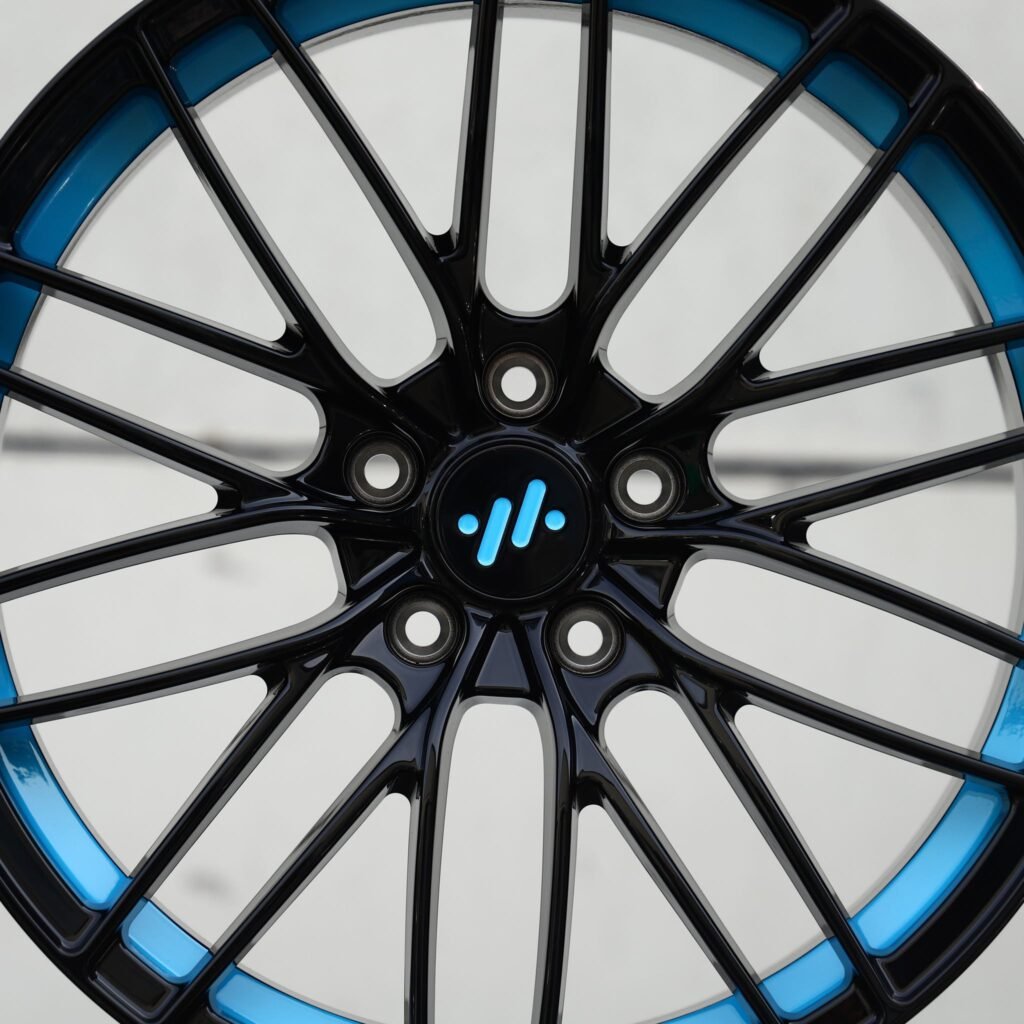 IM LS7 wheels – Gloss Black / Blue 10 Y-Spoke (IM OEM-Style), angled view