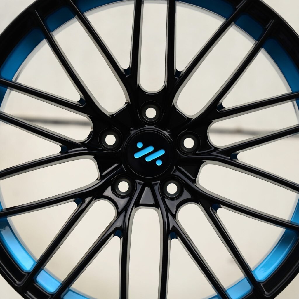 IM LS7 wheels – Gloss Black / Blue Lip 10 Y-Spoke Mesh (IM OEM-Style), angled view