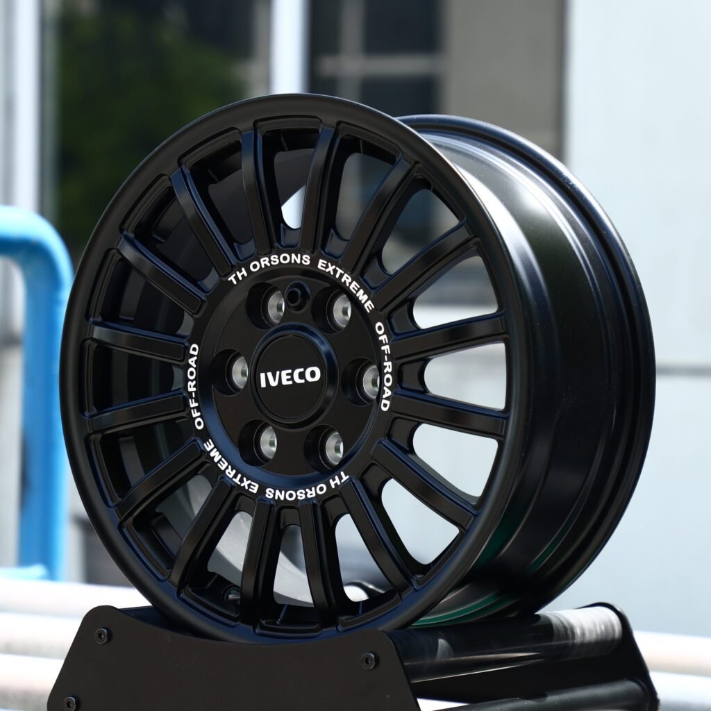 Isuzu MU-X wheels – Matte Black 15-Spoke Rally (Iveco OEM-Style), angled view