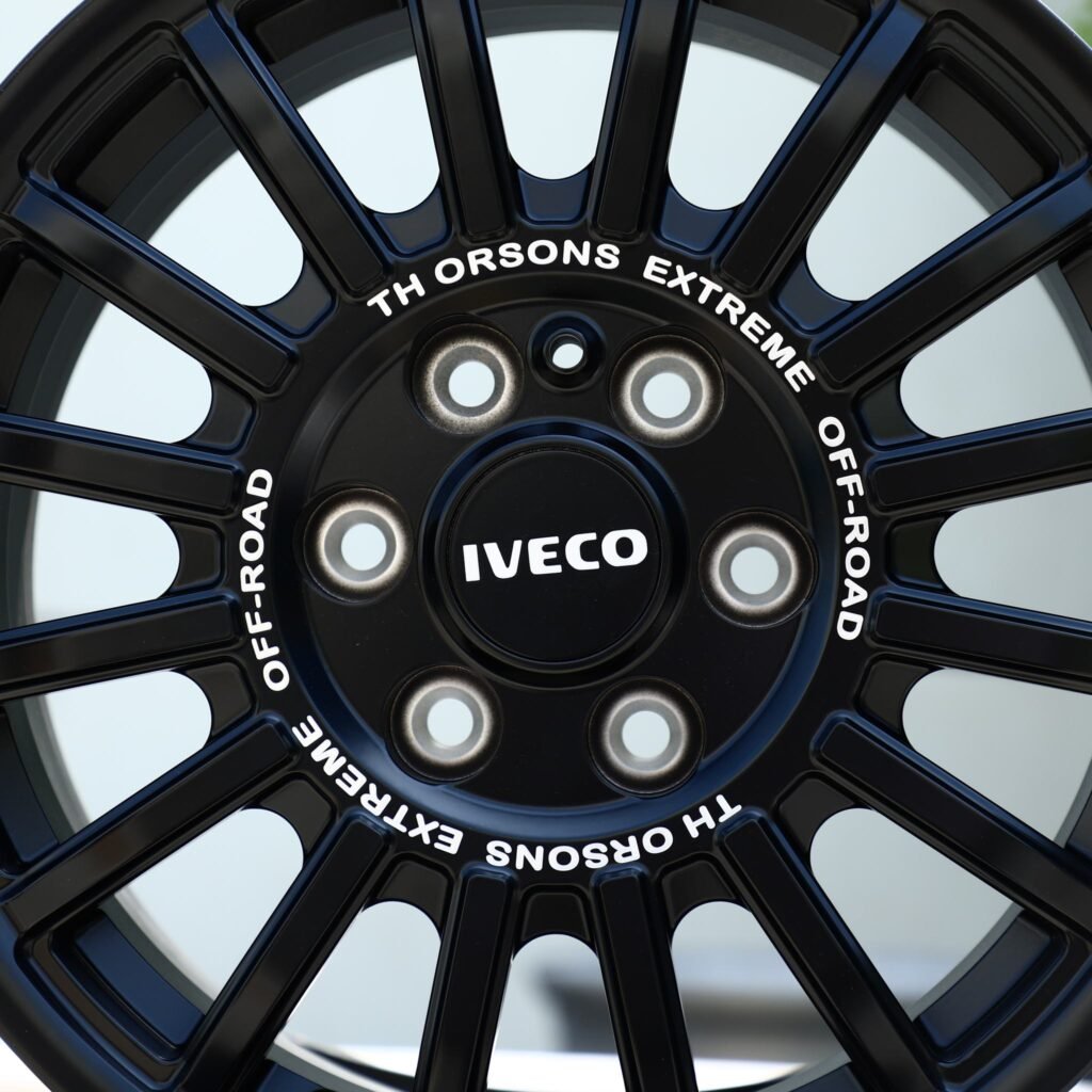 Toyota Tacoma wheels – Matte Black 15-Spoke Rally (Iveco OEM-Style), lip and barrel detail