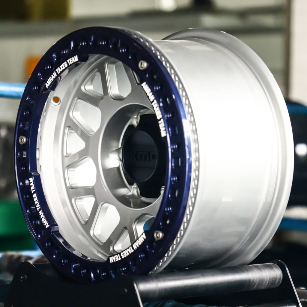 Toyota Tacoma wheels – KMC Blue / Silver Beadlock, angled view