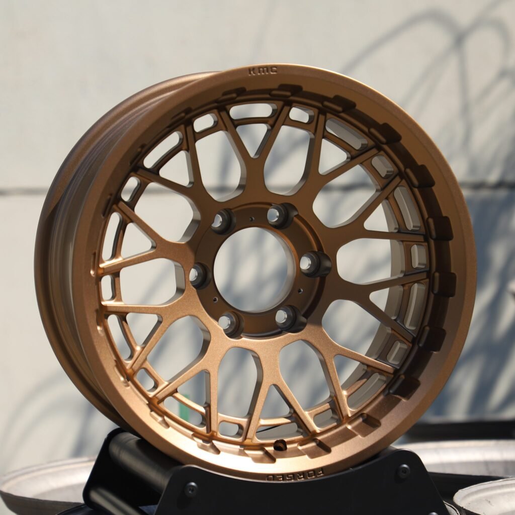 Toyota Tacoma wheels – KMC Bronze Custom, angled view