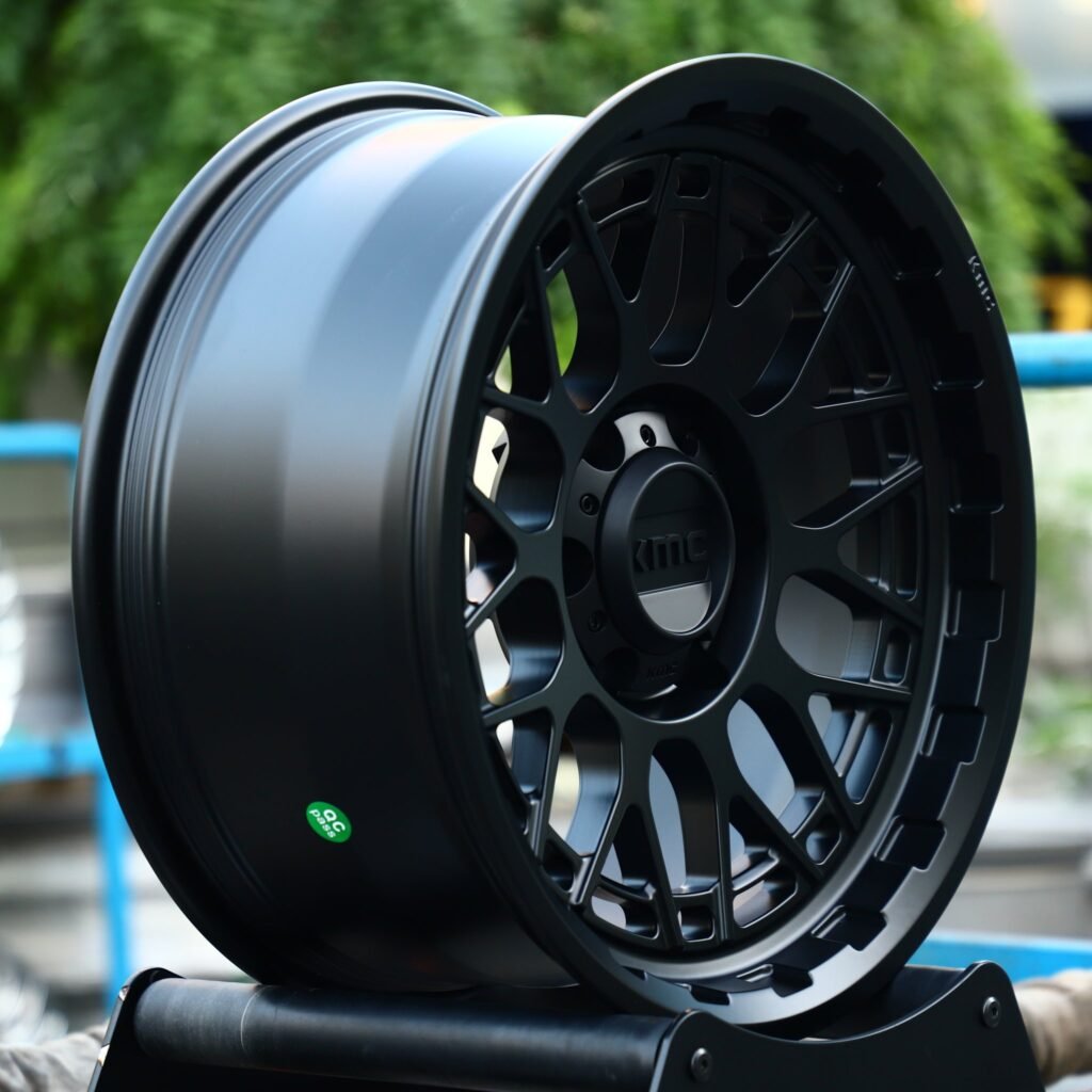 Toyota Tacoma wheels – KMC Gloss Black Deep Lip, angled view