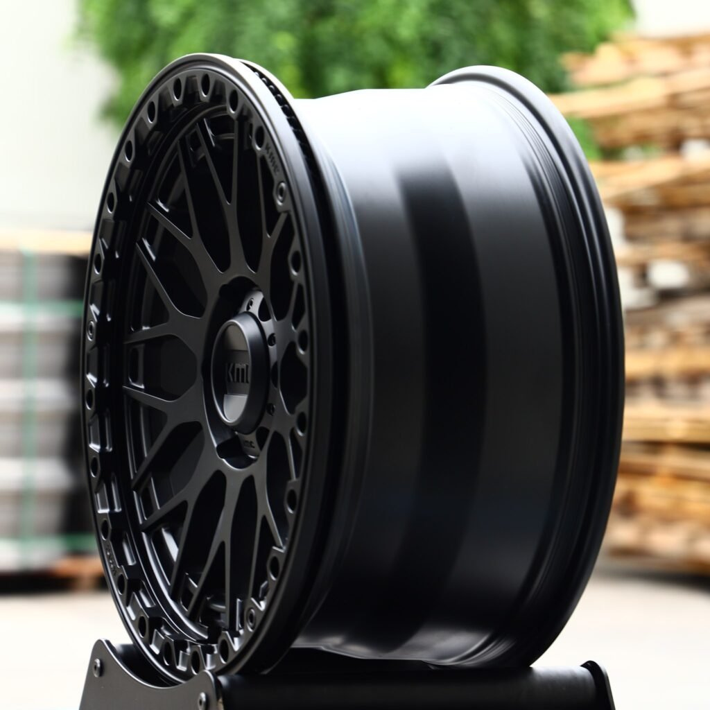 Toyota Tacoma wheels – KMC Gloss Black Double Ring Lip Beadlock, angled view