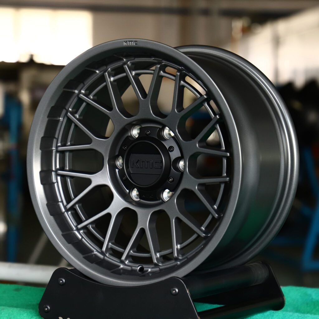 Toyota Tacoma wheels – KMC Gloss Black / Gunmetal / Gray Deep Lip Double Ring Lip, angled view