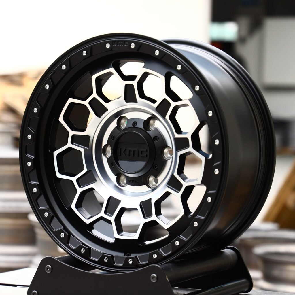 Toyota Tacoma wheels – KMC Gloss Black Riveted, angled view