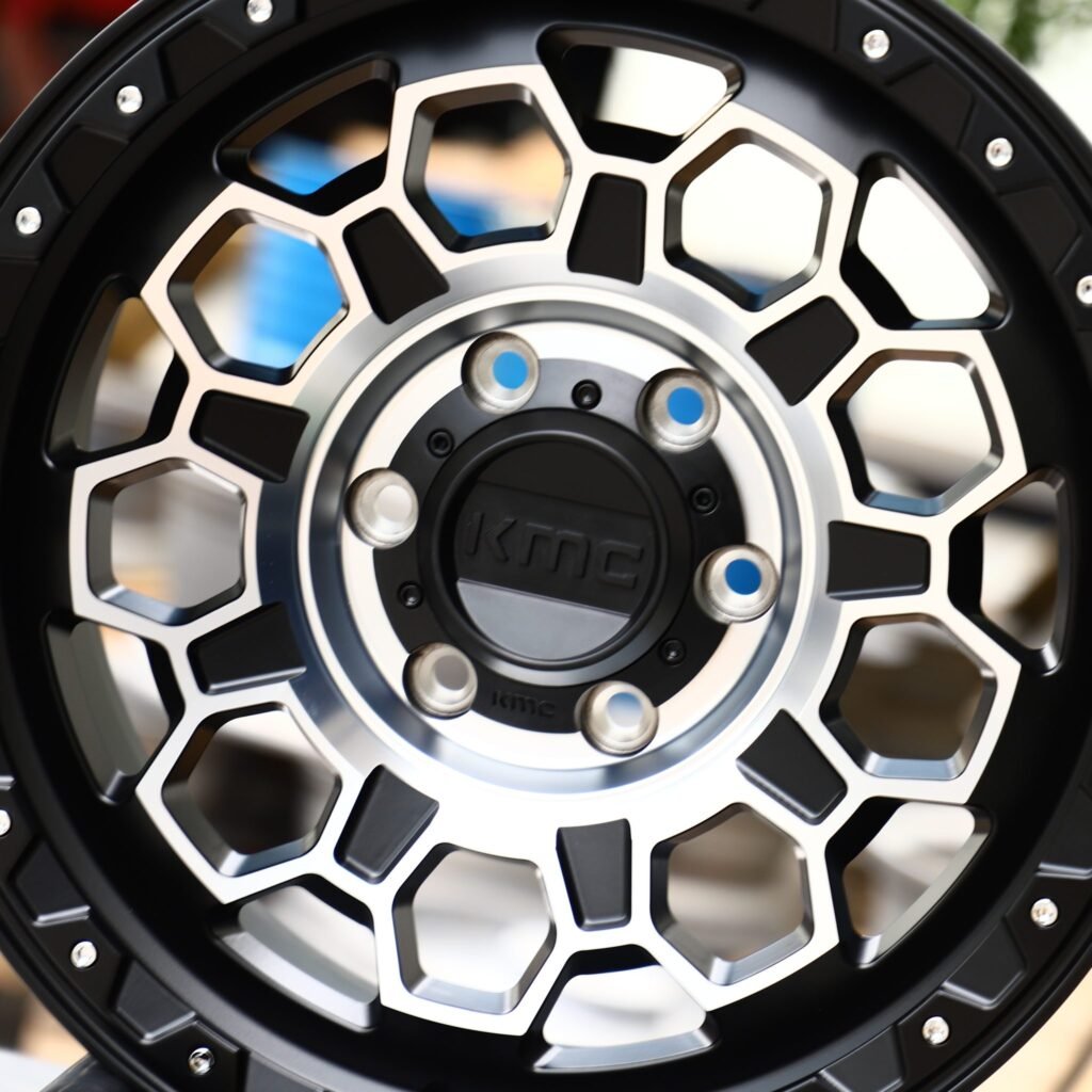 Chevrolet Silverado 1500 wheels – KMC Gloss Black Riveted, lip and barrel detail