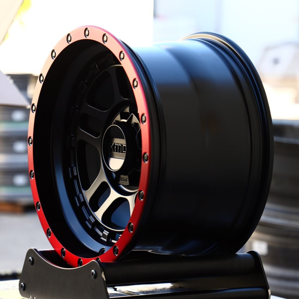 6x139.7 wheels – KMC Red / Black Deep Lip Double Ring Lip, side view