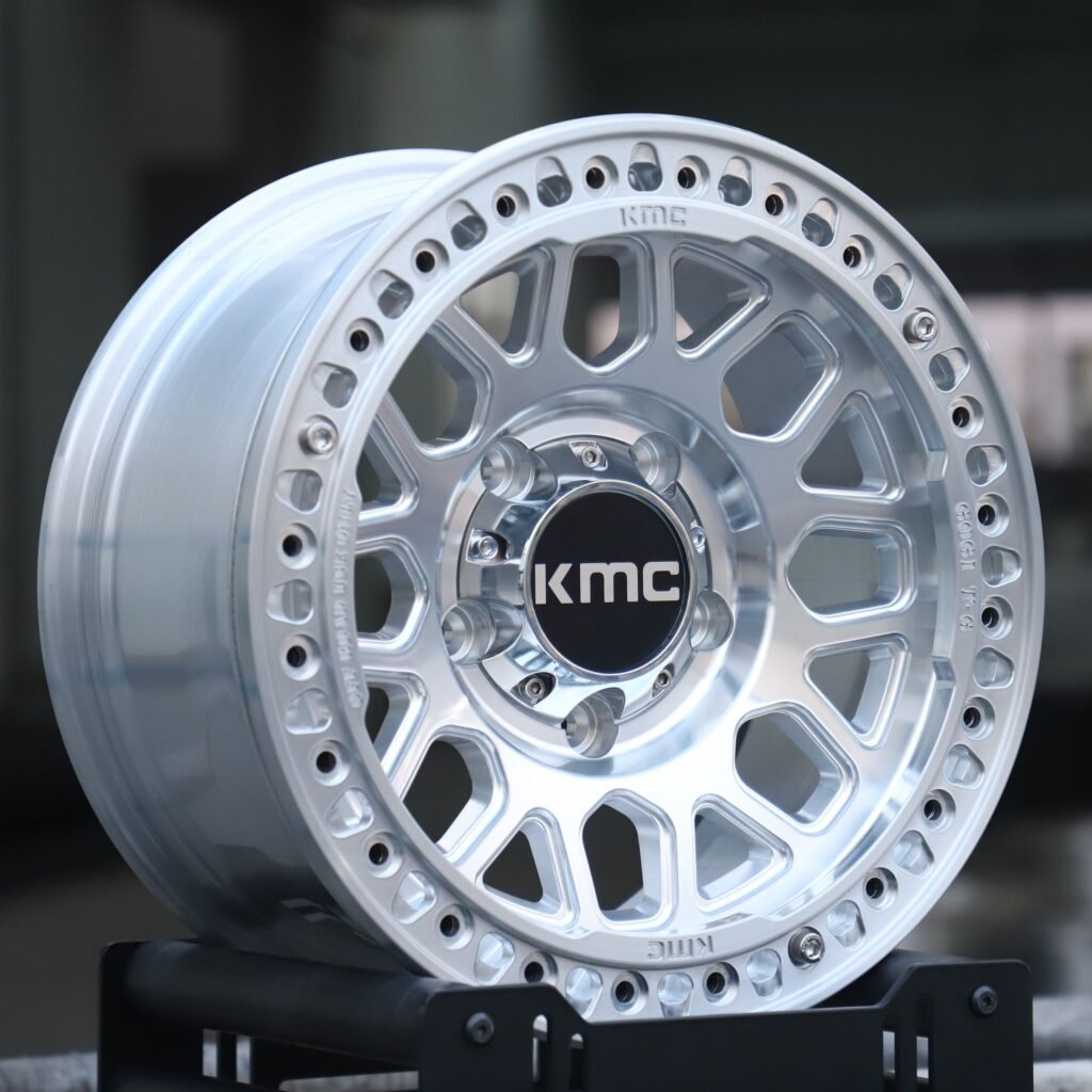 Toyota Tacoma wheels – KMC Silver Custom Beadlock, angled view