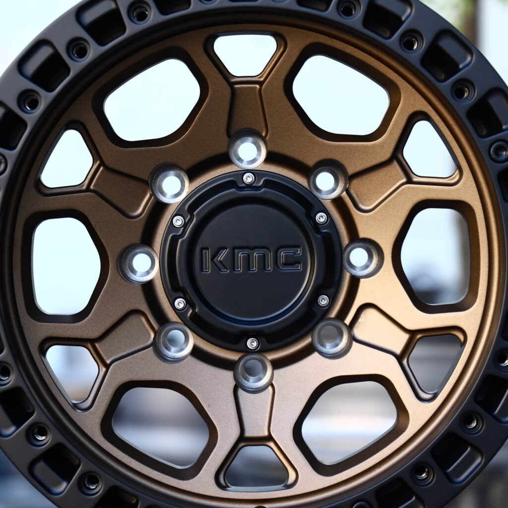 GMC Sierra 2500HD wheels – Bronze / Gloss Black 8-Spoke Beadlock (KMC-Style), lip and barrel detail