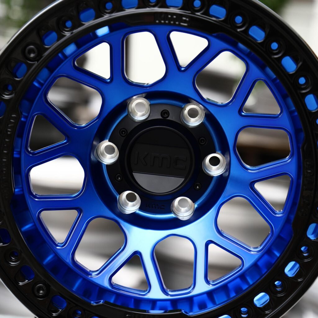 6x139.7 wheels – KMC Transparent / Blue / Gloss Black Beadlock, side view