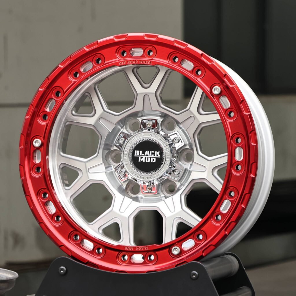 Toyota Tacoma wheels – KMC Transparent Red Custom Beadlock, angled view