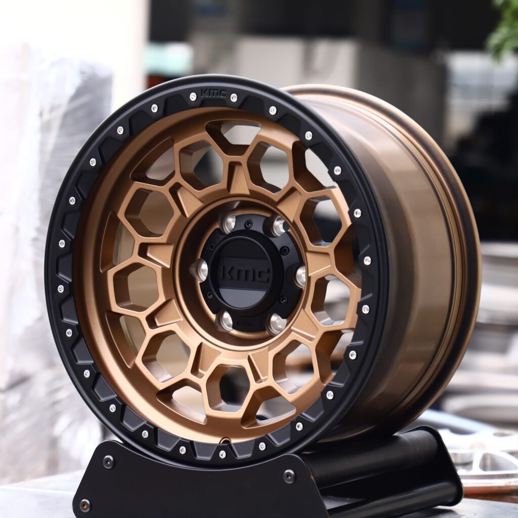 Chevrolet Silverado wheels – KMC Wheels Bronze / Gloss Black Exposed Bolt Detail, angled view