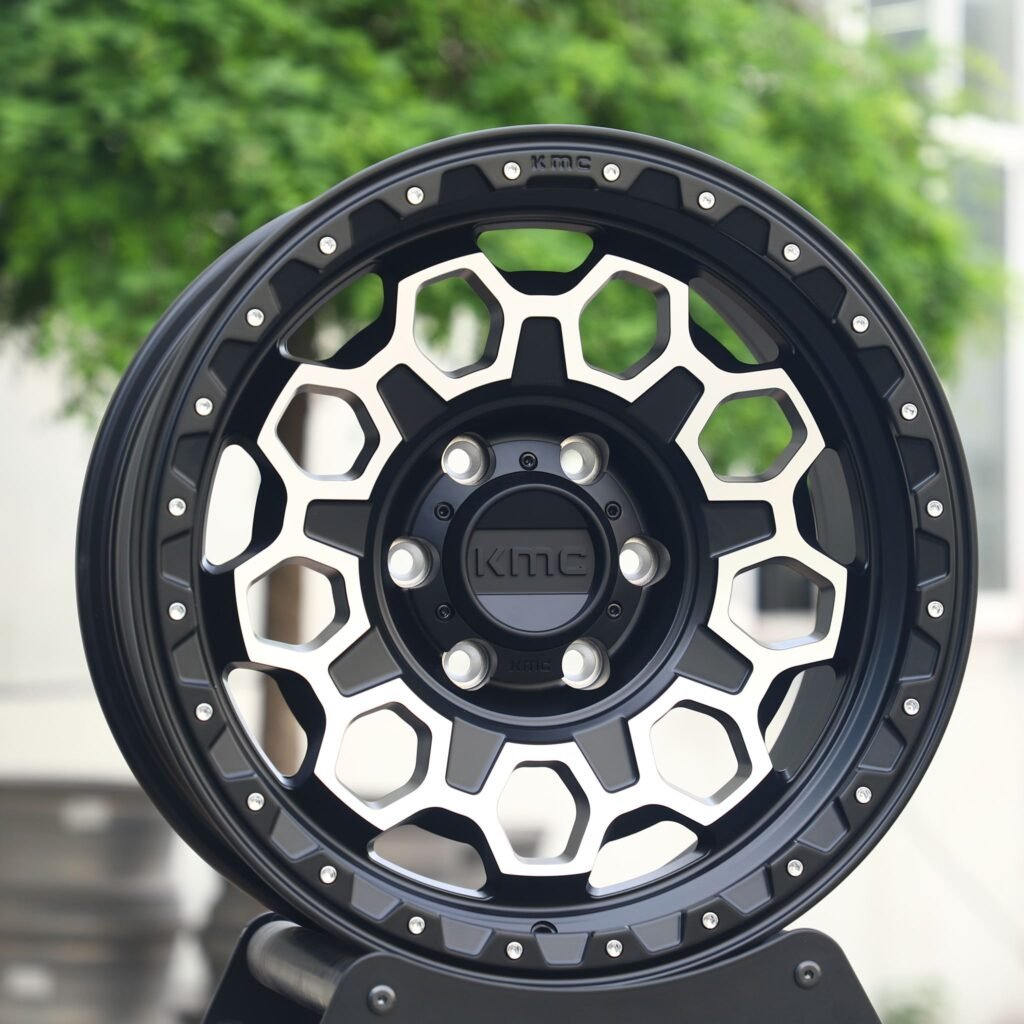 Chevrolet Silverado wheels – KMC Wheels Matte Black Exposed Bolt Detail, angled view
