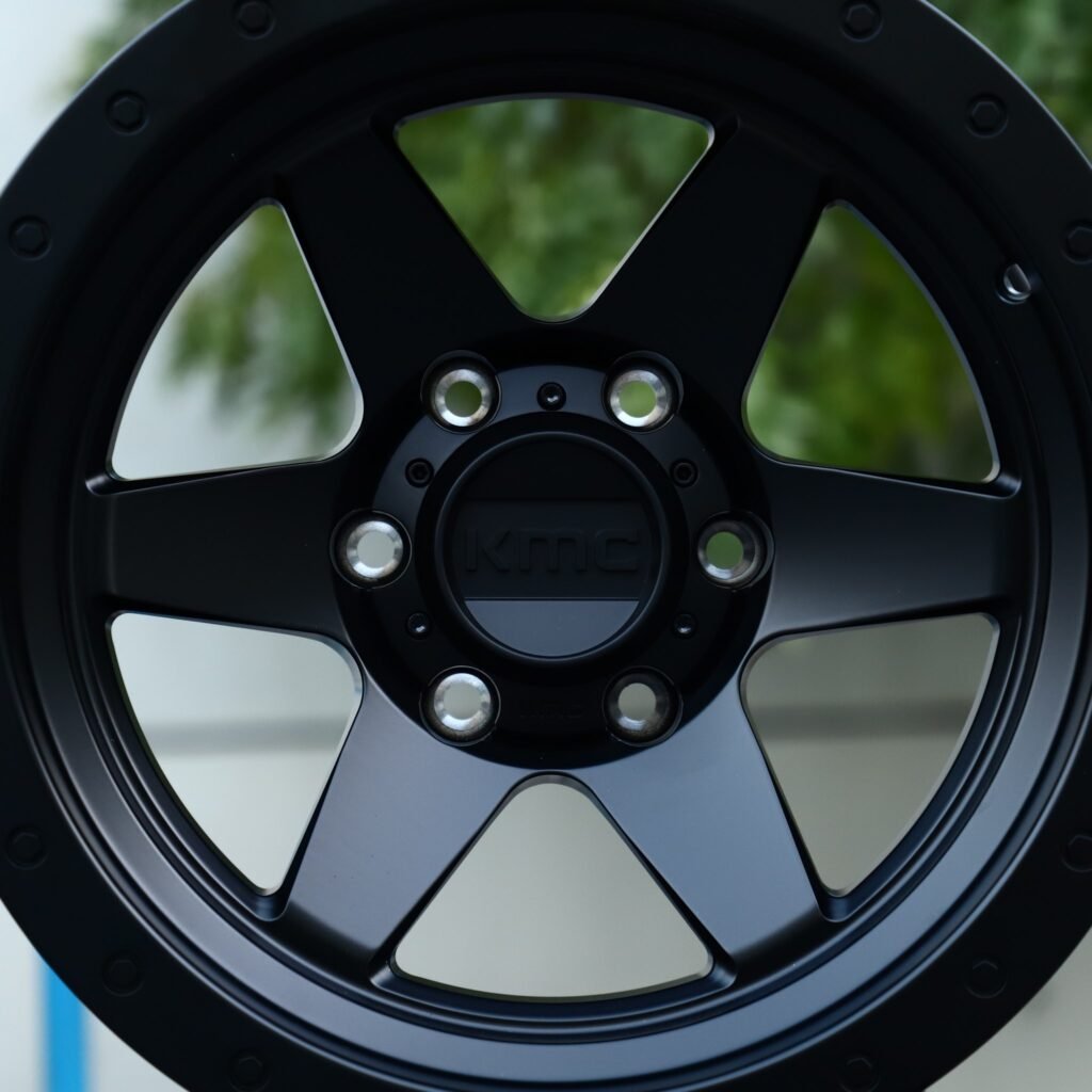 Toyota Tacoma wheels – Matte Black 6-Spoke Semi-Full-Face Exposed Bolt Detail (KMC-Style), lip and barrel detail