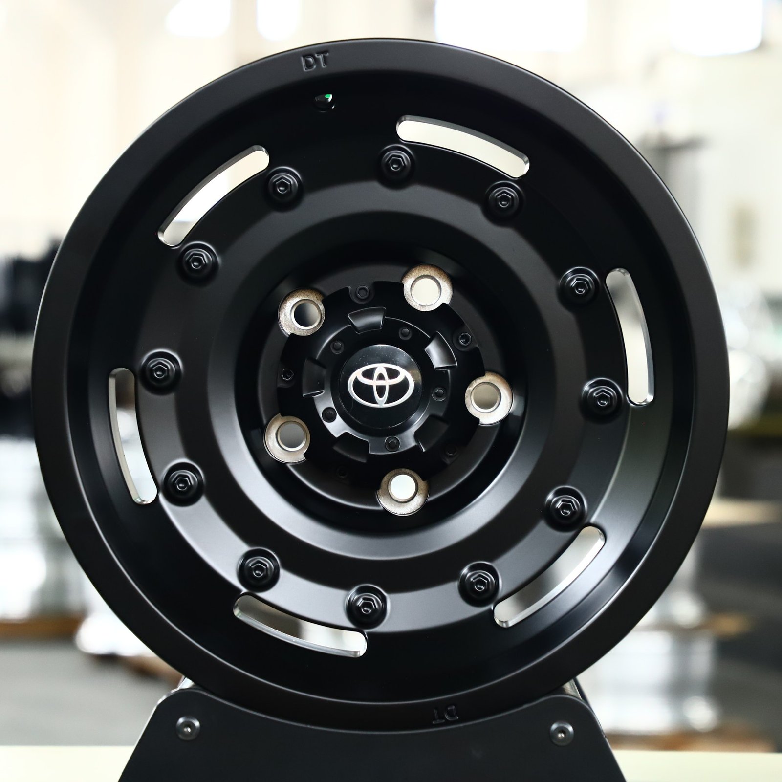 Toyota Tacoma wheels – Matte Black Exposed Bolt Detail, front view