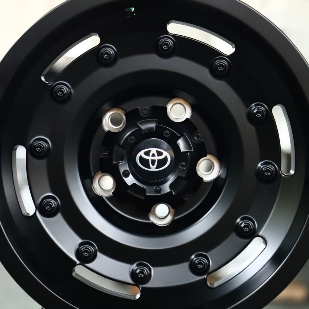 6x139.7 wheels – Matte Black Exposed Bolt Detail, side view